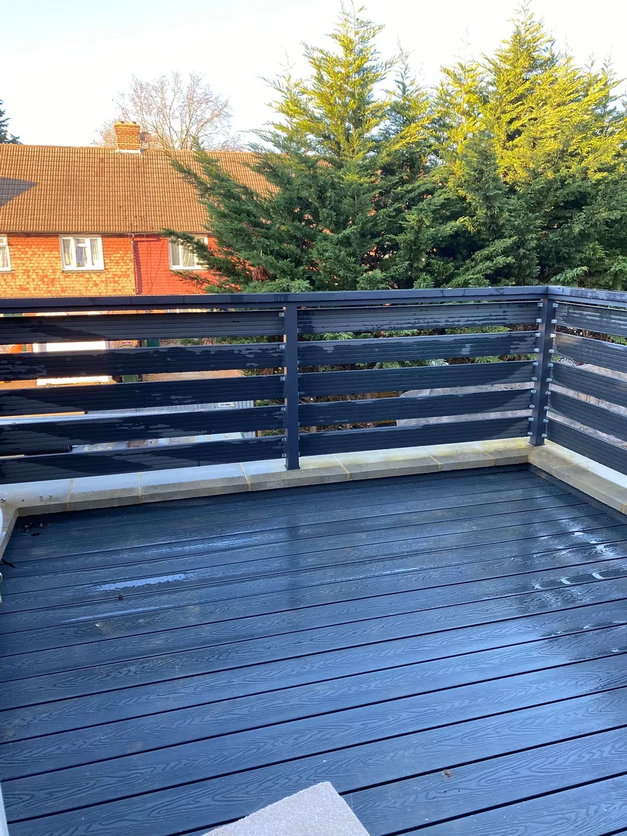 EPDM flat roof replacement being installed by roofers on a Surrey residential property — Never Felt Better