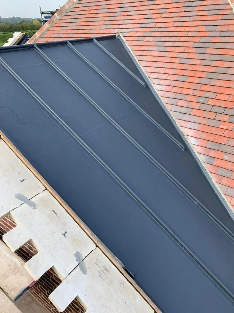 New GRP flat roof section adjoining clay tile pitched roof — Never Felt Better Roofing, Surrey