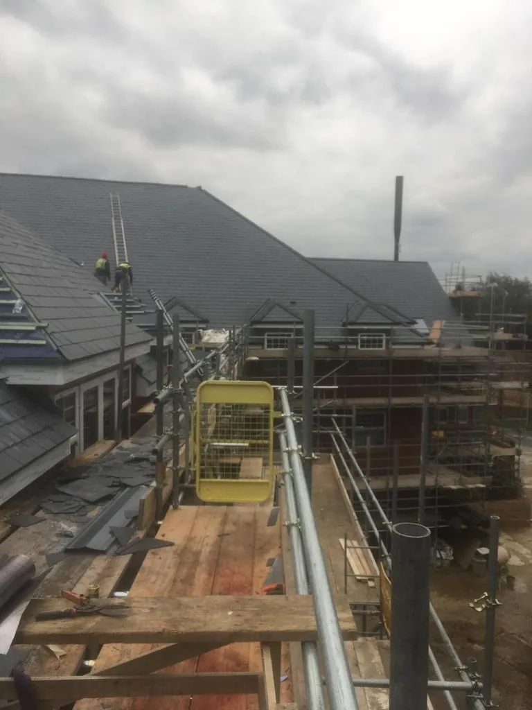 New slate roof installation with scaffold — Never Felt Better Roofing, Surrey